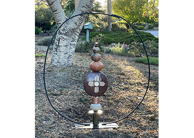 totem sculpture stack of ceramic pieces within a steel circle