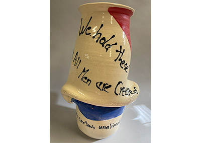 Torqued ceramic jar entitled We Hold These Truths